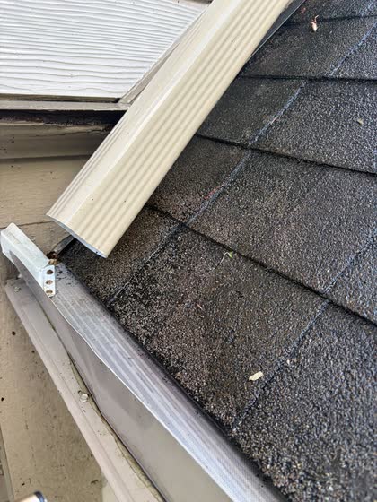 The same gutter corner, empty and clean down to the metal.